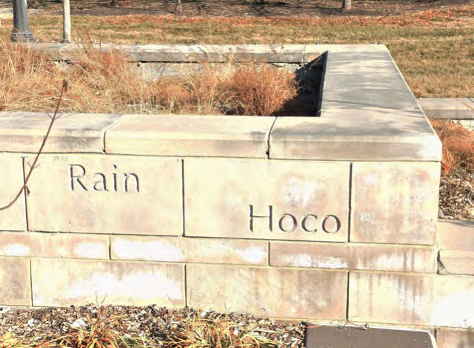 Limestone walls along the stepped plaza are engraved